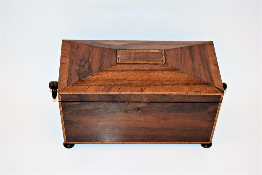 A Regency Rosewood tea caddy with fully fitted interior.