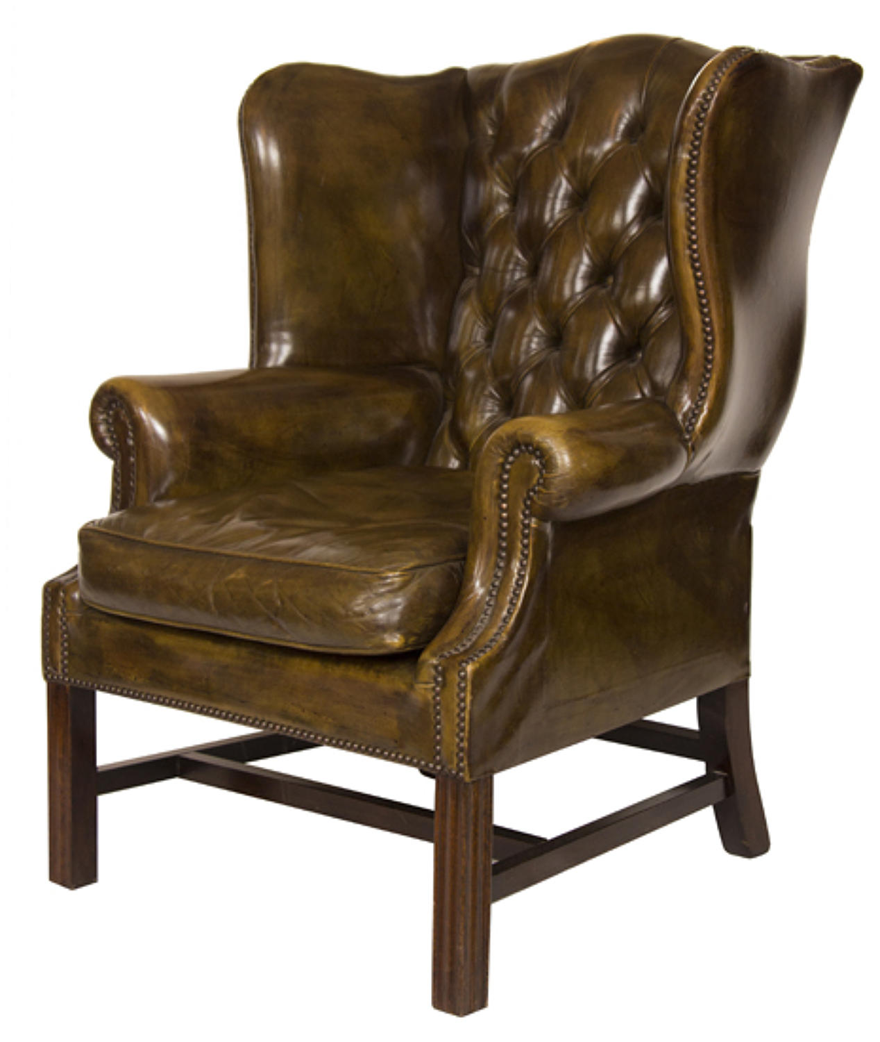 A superb deep green leather wing chair