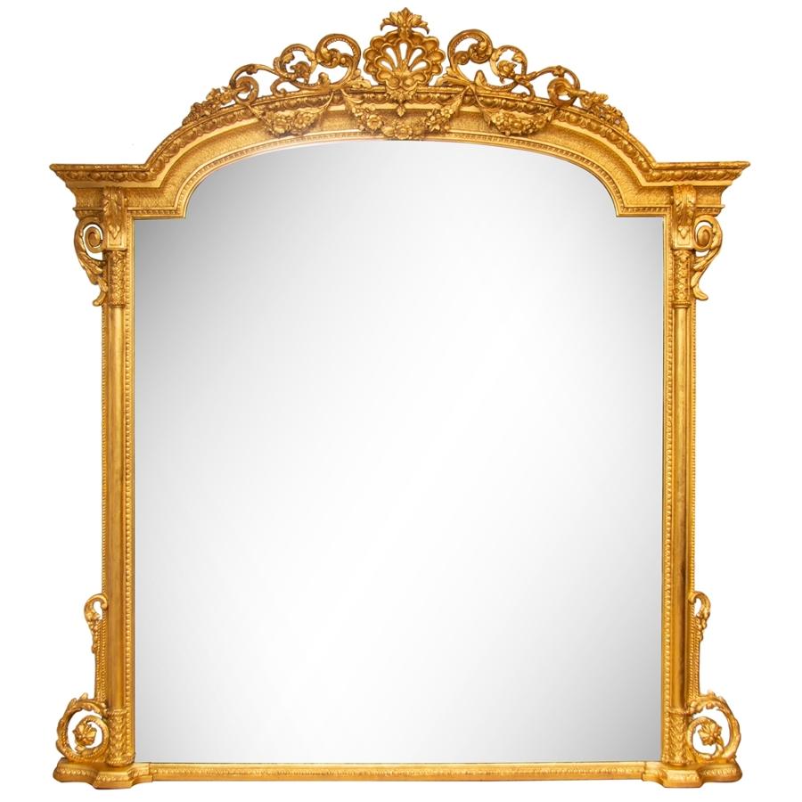 A large Antique gilded overmantle mirror.