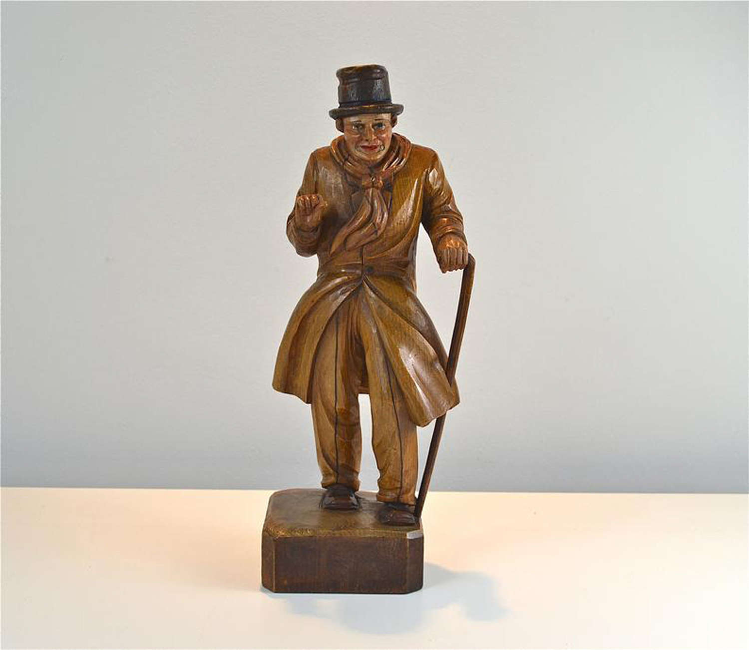 Antique carved wooden figure of a well dressed gentleman