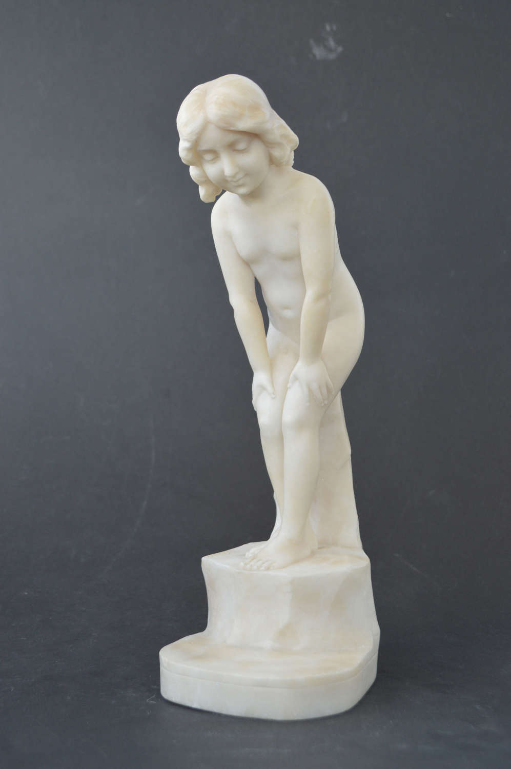 Antique sculpture of a young girl
