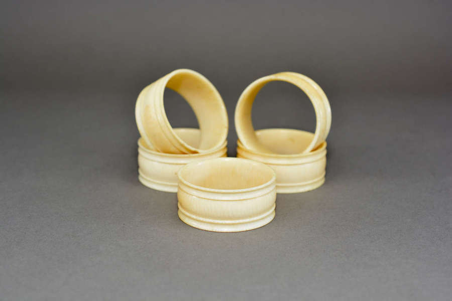 Set of five antique turned ivory napkin rings