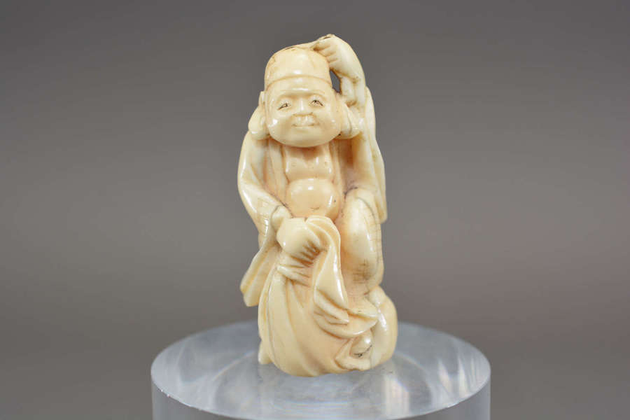 Hand carved antique ivory Chinese immortal god figure