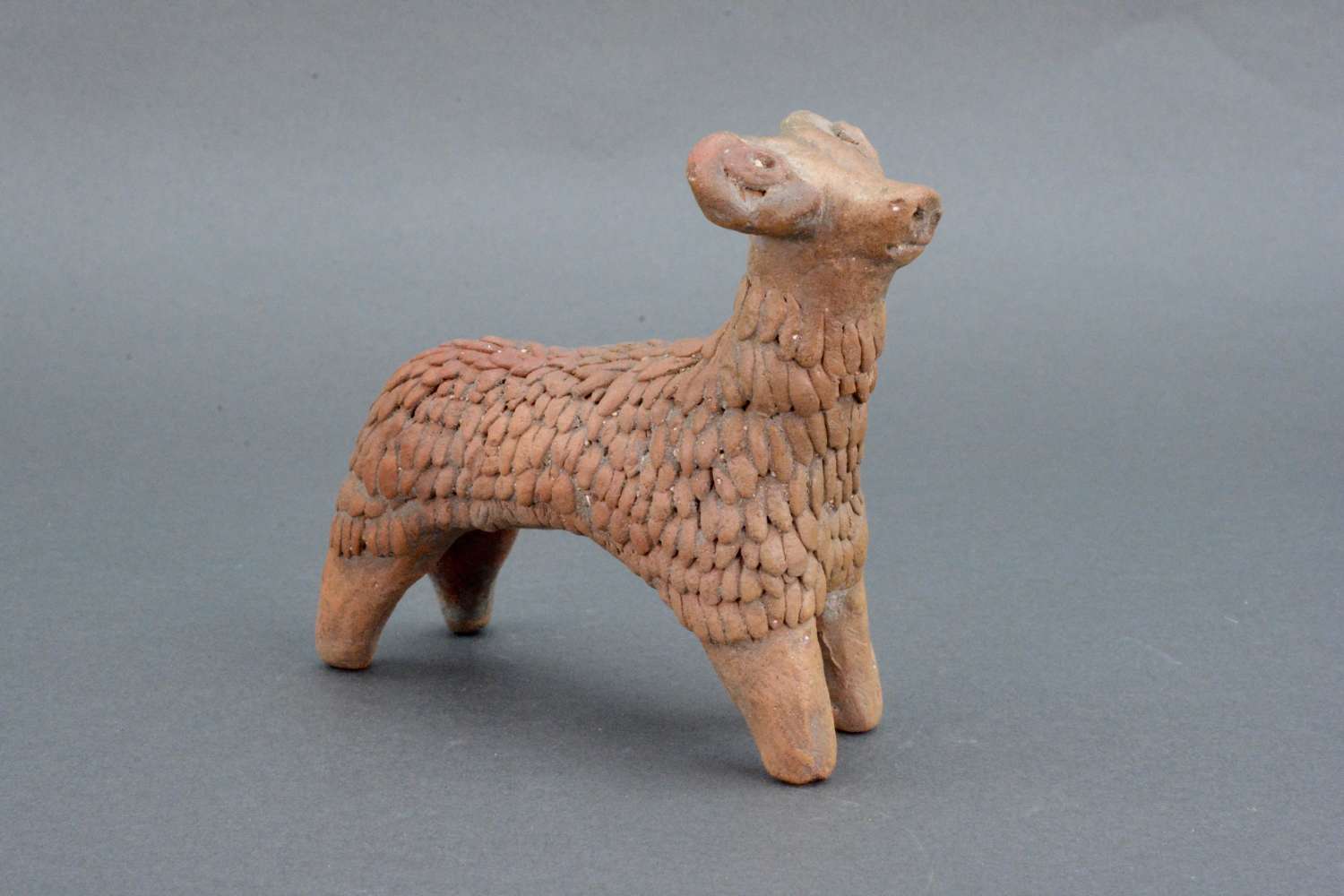 An ancient pottery figure of a ram hand made in Syria