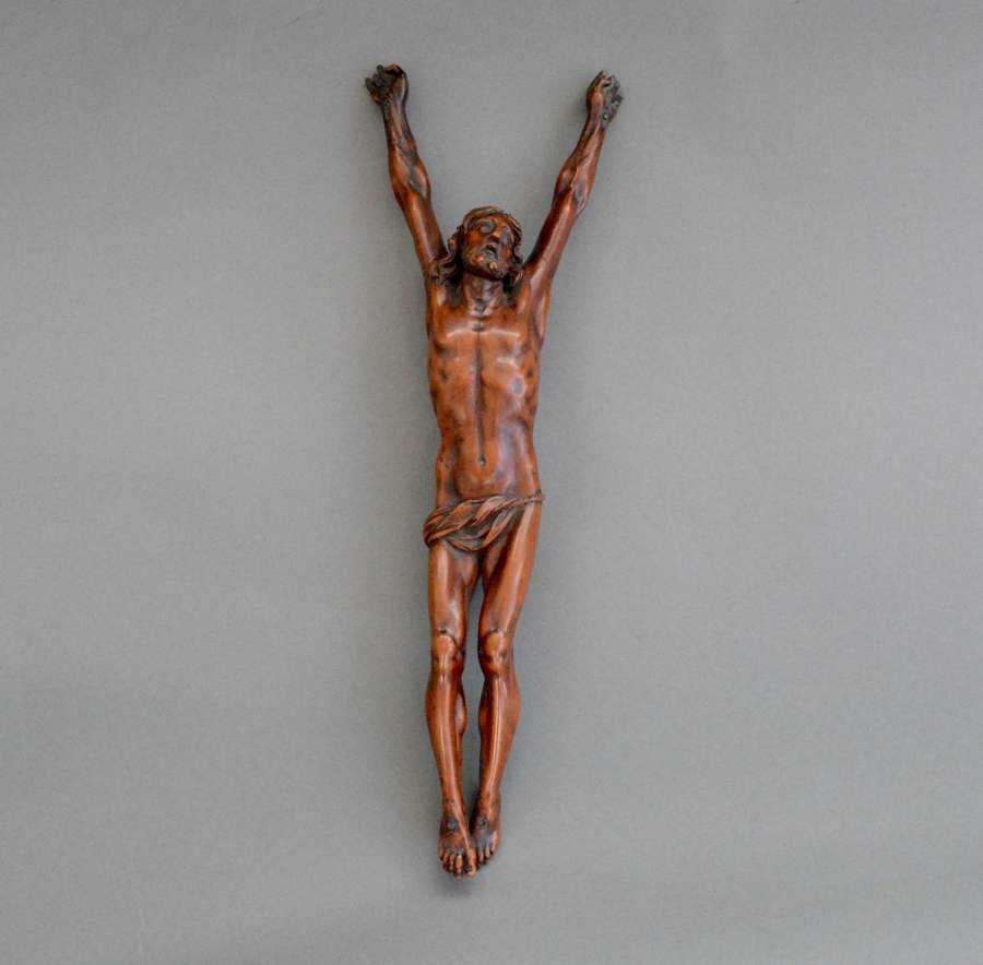 A hand carved fruitwood corpus figure from the18th century