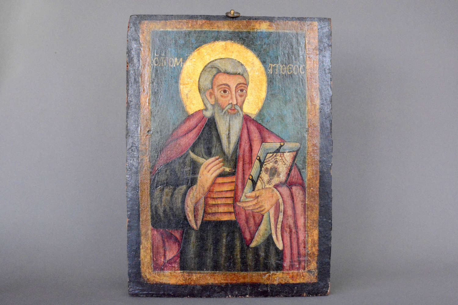 A late 19thC icon oil on panel depicting Saint Nicholas.