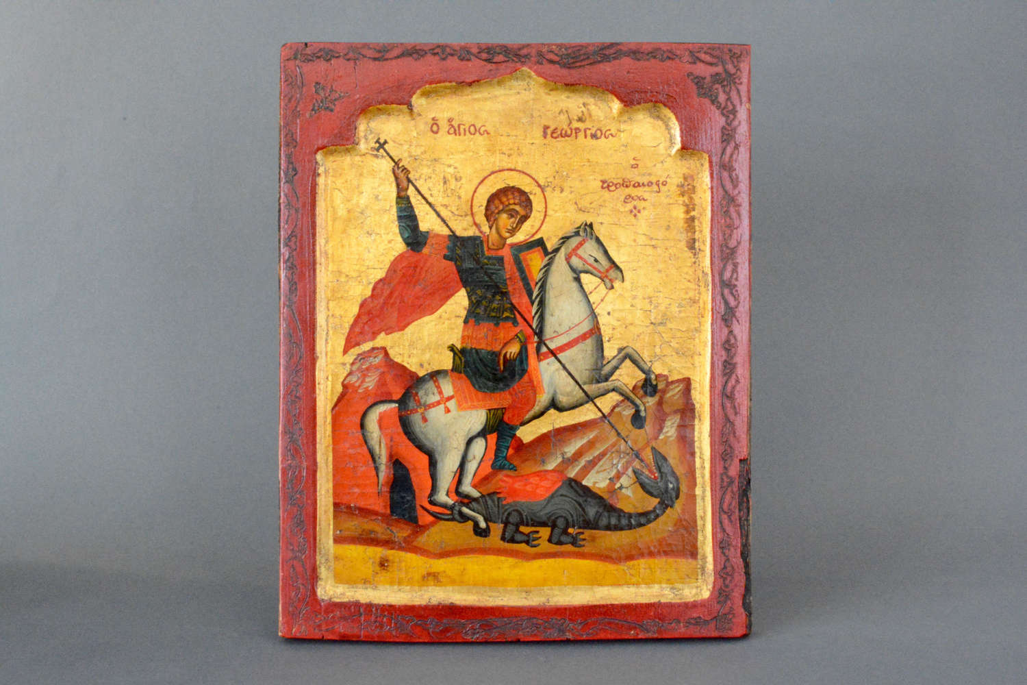 Decorative Holy Icon Saint George on horseback slaying the dragon.