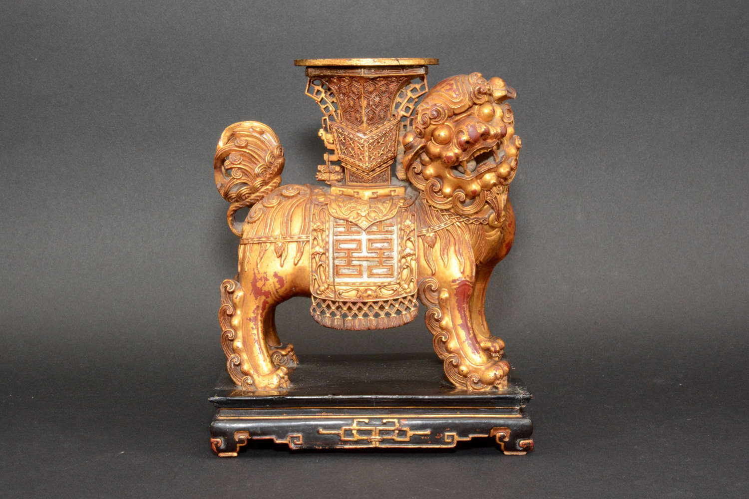 A Chinese giltwood figure of a temple lion, late 19th century