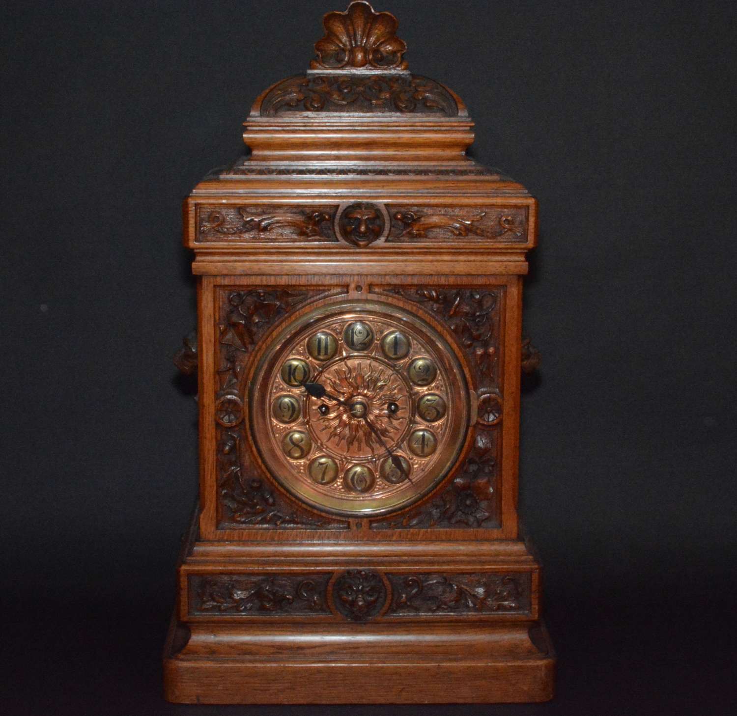 A superb Arts and Crafts hand carved oak clock Circa 1900