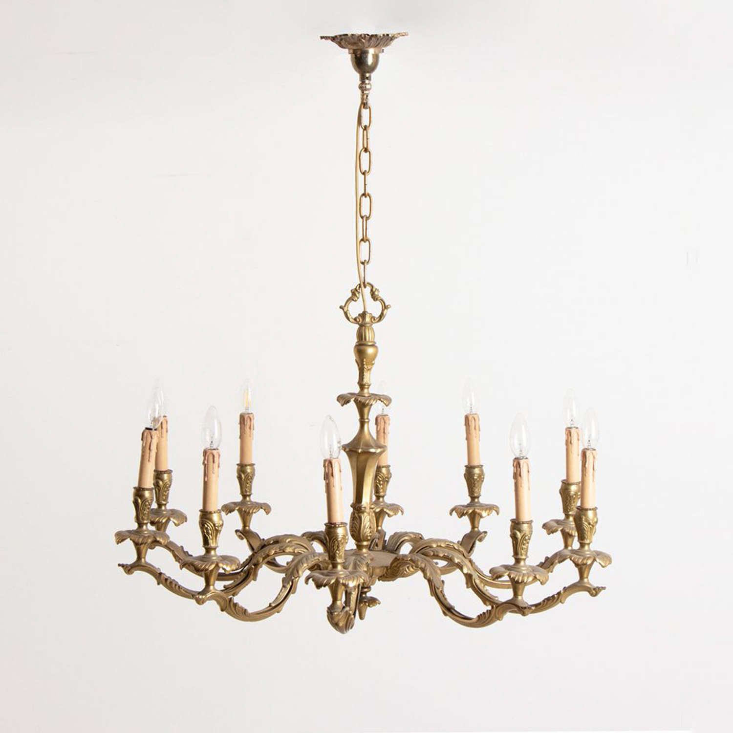 A large 19thC solid brass 10 branch baronial chandelier