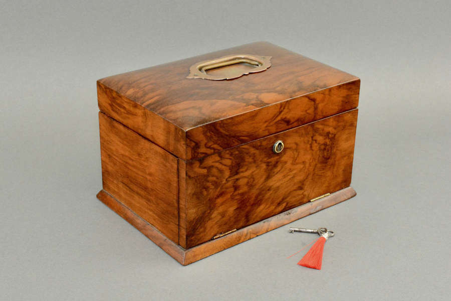 A Victorian walnut jewellery box with fitted interior.