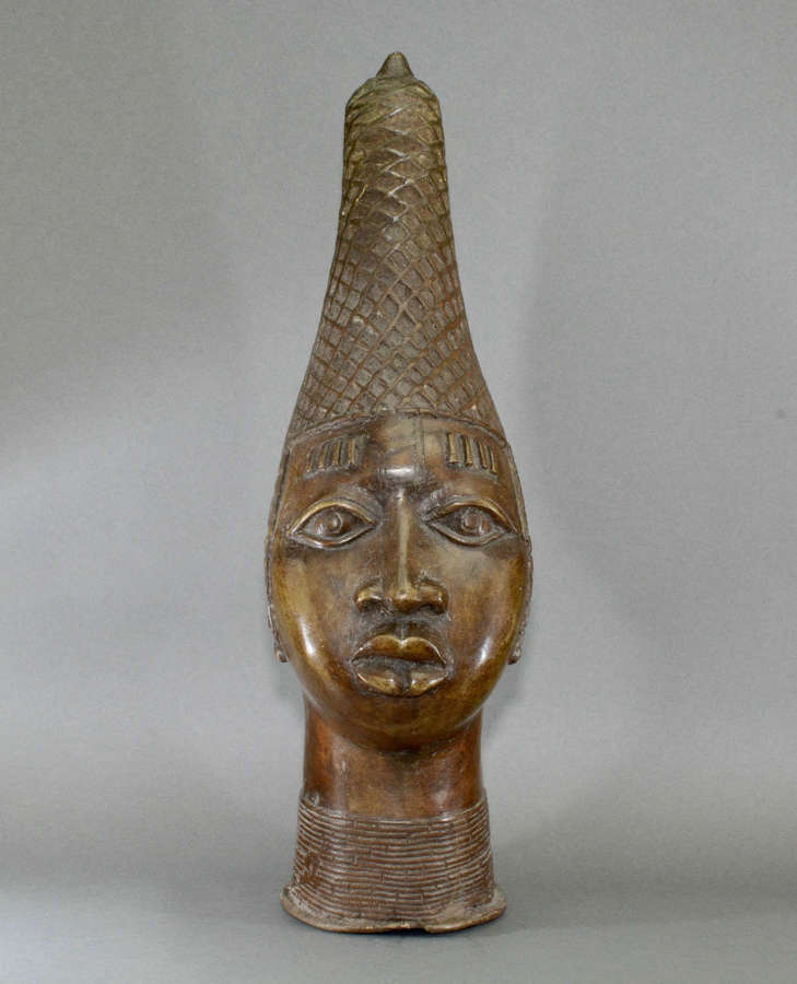 A striking Benin bronze head of Lyoba Idia. Good patination and colour